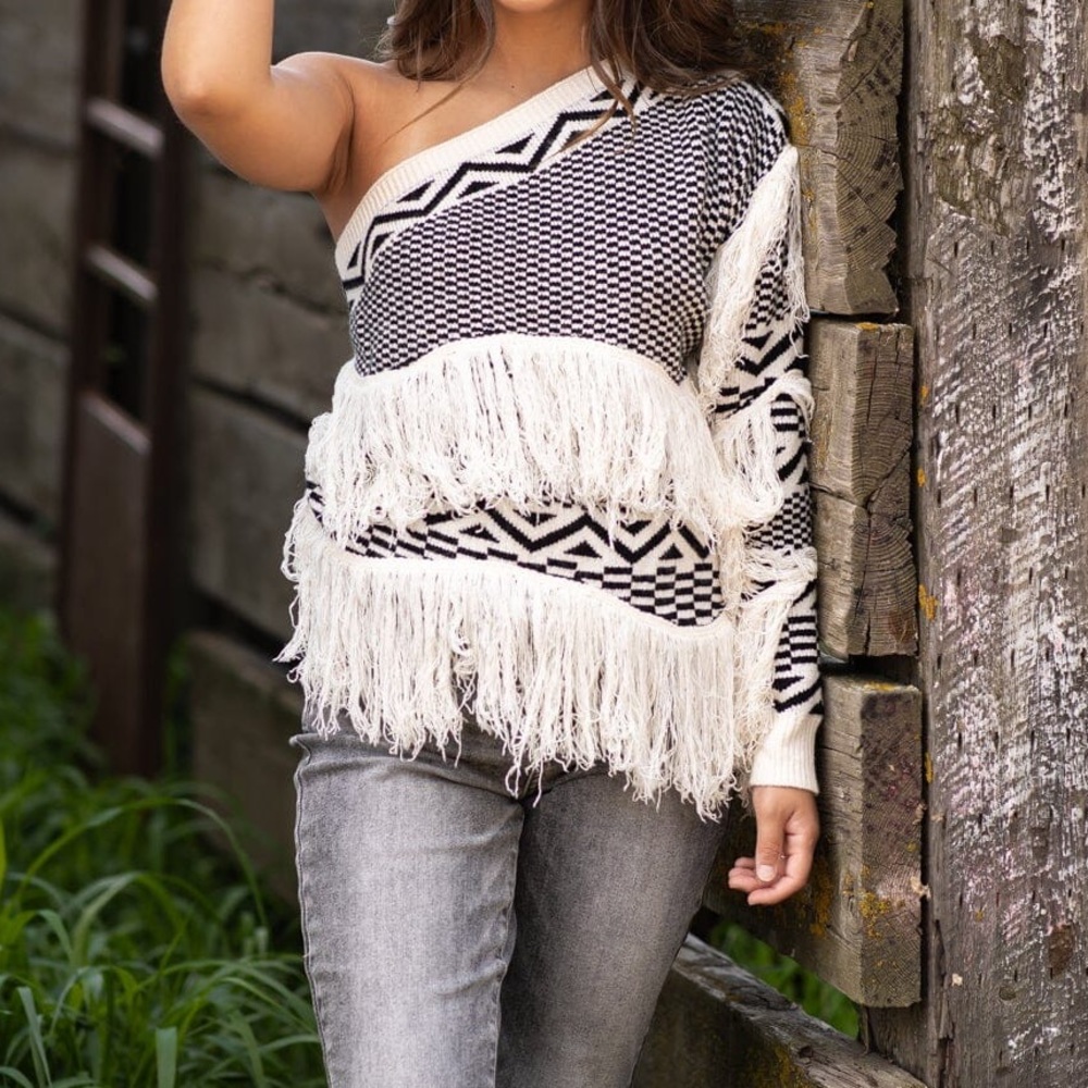 Black and white one sleeved boho fringe sweater size small